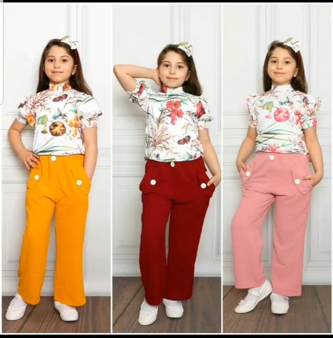 Children's blouse with a floral pattern and vibrant colors