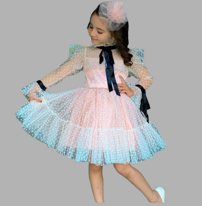 Luxurious children's dress with polka dots and sheer sleeves